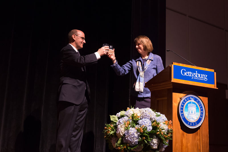 Pres. Iuliano and Pres. Riggs share a toast