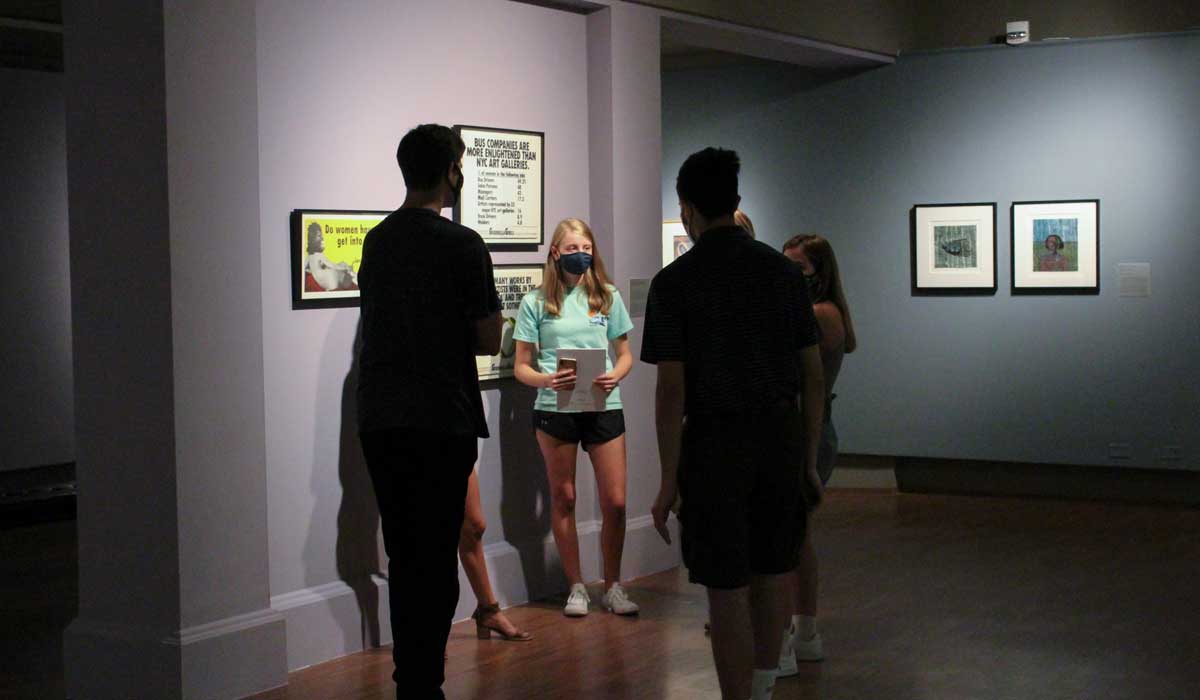 People viewing Mexico and the People exhibition at the Schmucker Art Gallery