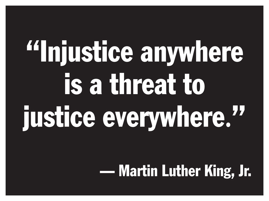 Sign with Martin Luther King quote - Injustice anywhere is a threat to justice everywhere