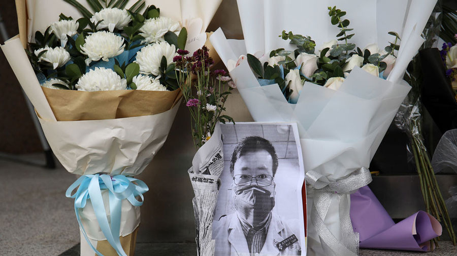 Flowers and a photograph of doctor Li Wenliang